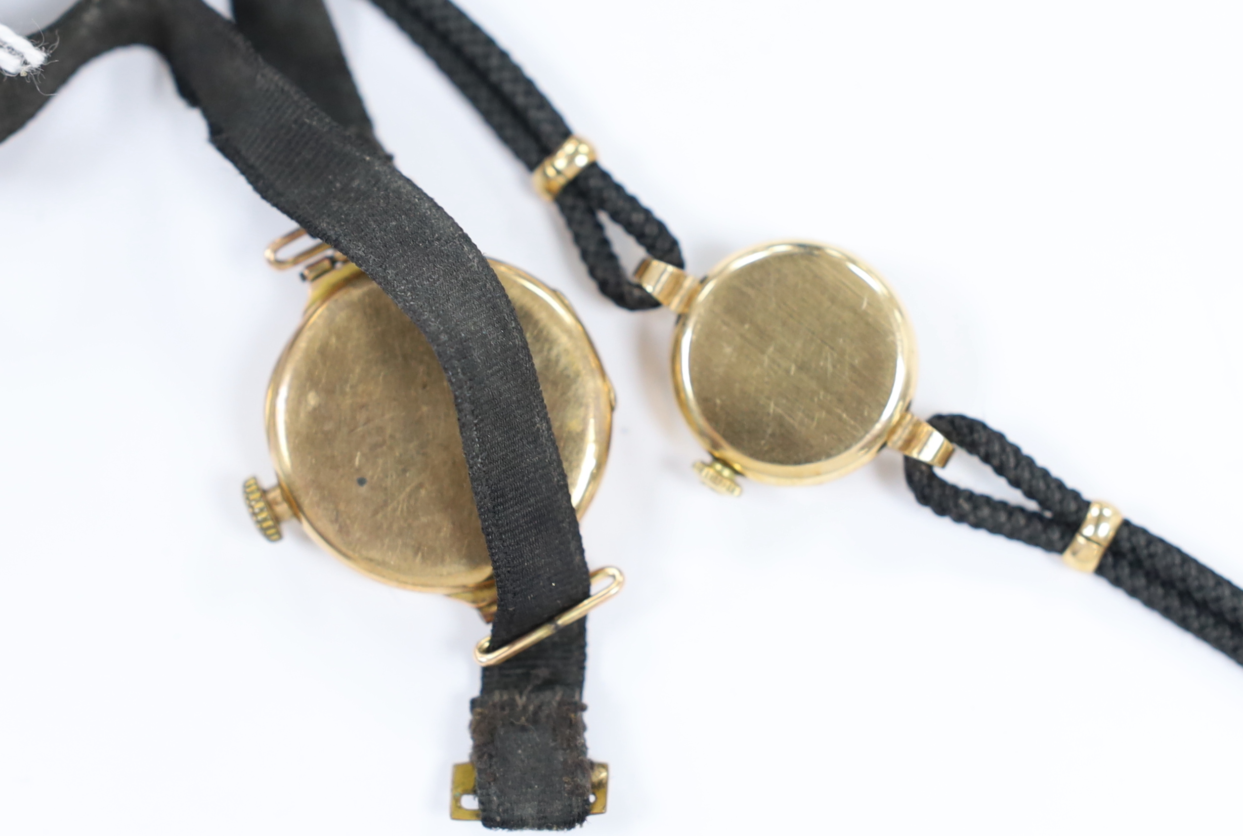 A lady's early 1960's 9ct gold Omega manual wind wrist watch, on a twin strand fabric strap, together with one other 9ct gold and enamel manual wind wrist watch.
